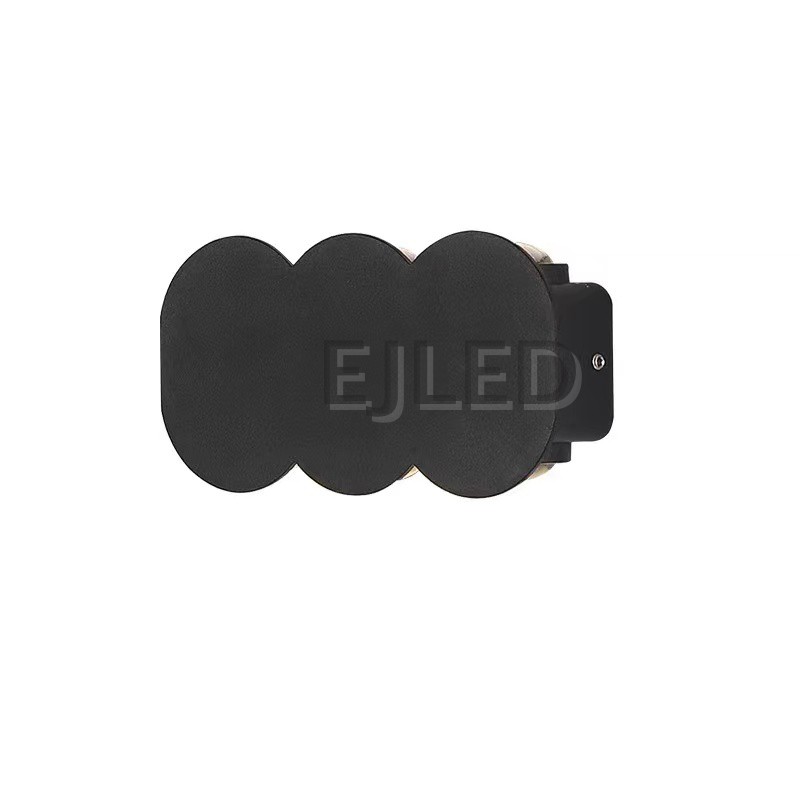 This black aluminum wall light features a distinctive three-circle shade design and mounts securely to vertical surfaces for project applications. Model WL0036.