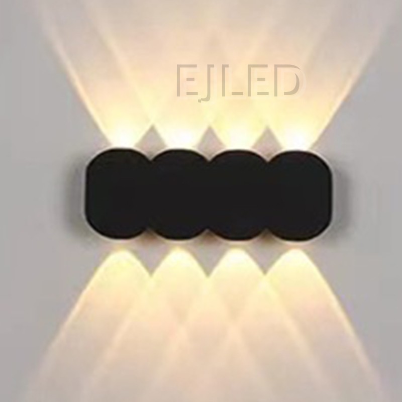 This black aluminum wall light features a distinctive three-circle shade design and mounts securely to vertical surfaces for project applications. Model WL0036. - view 2